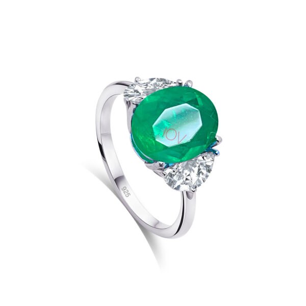 925 sterling silver ring with emerald color stone.