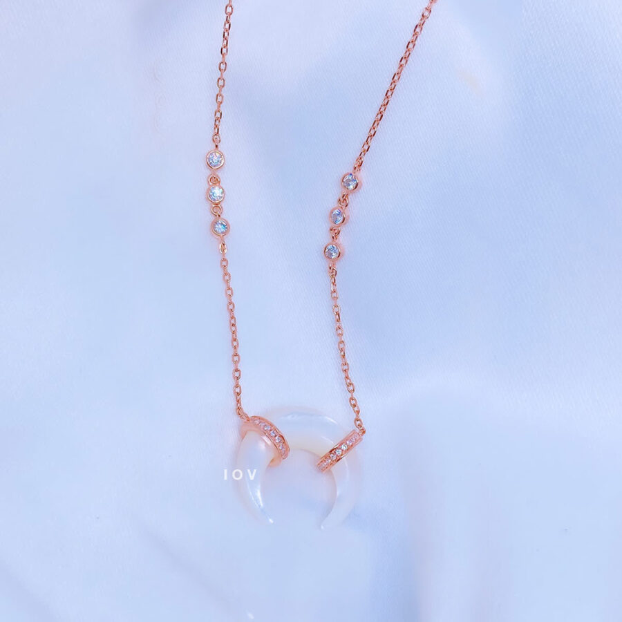 mother of pearl crescent shape rose gold necklace.