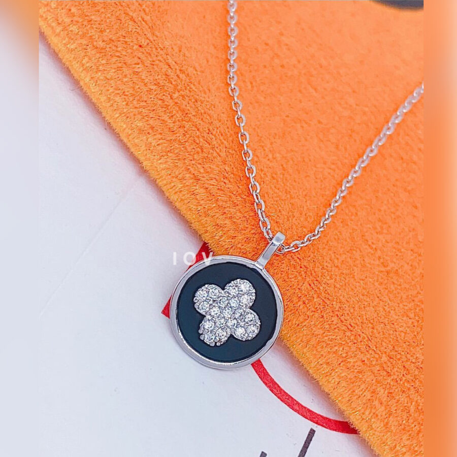 four clover flower shape on enamel background.