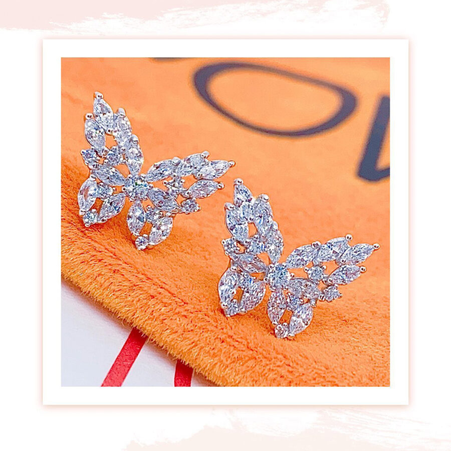 butterfly shape earrings with marquise and round stones.
