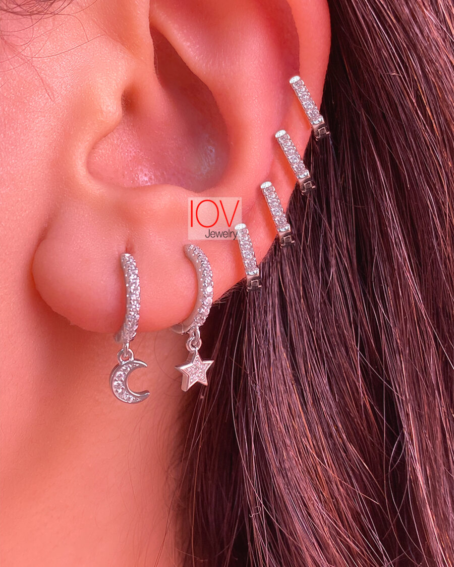 CZ hoops earrings with dangling star and crescent shapes.