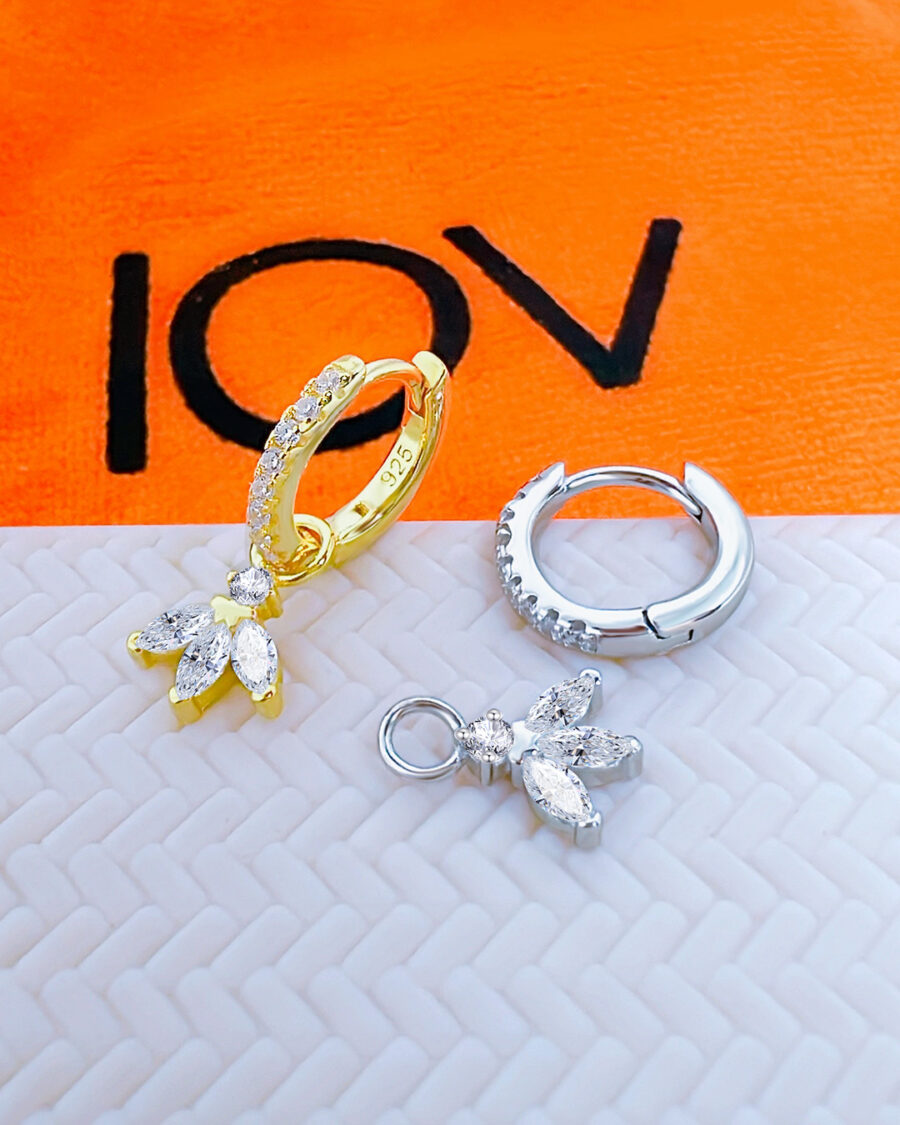CZ huggie hoop earring with dangling marquise shape stones.