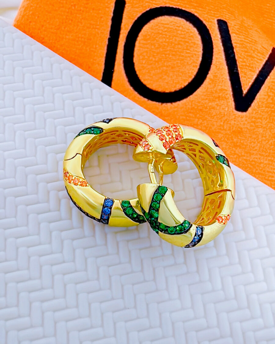 chunky wide hoop earring studded with colorful CZ.