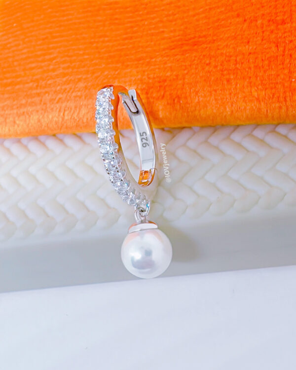 11 mm CZ hoop earring with dangling cultured pearl.