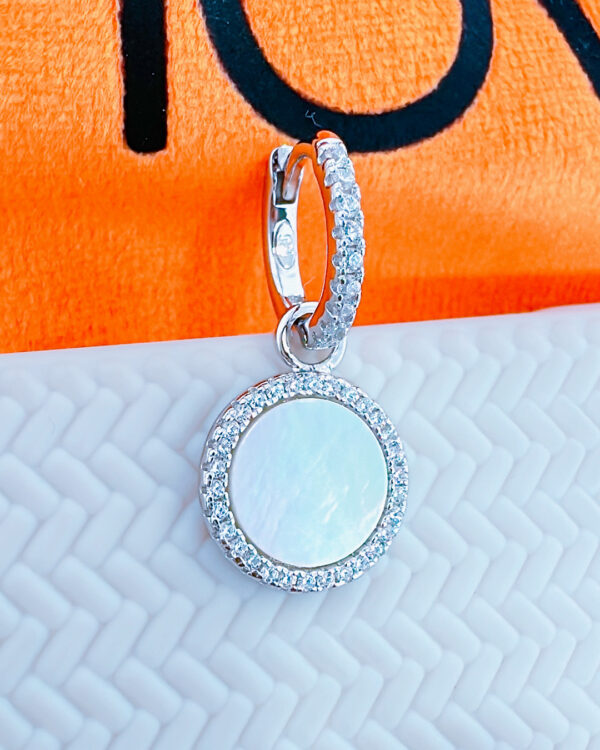 9mm CZ hoop earring with a mother of pearl dangling in a halo setting.