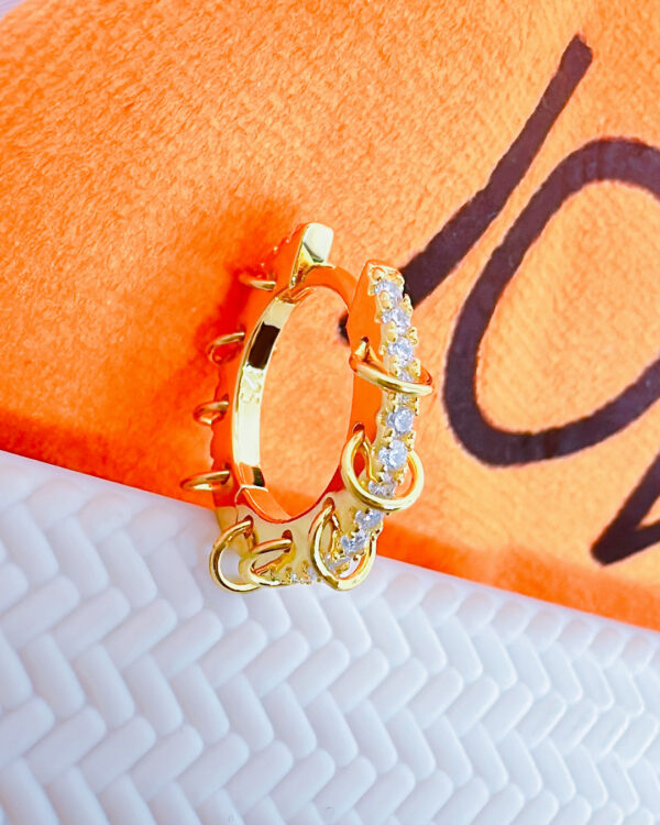 11mm huggie hoop earring with dangling small plain hoops.