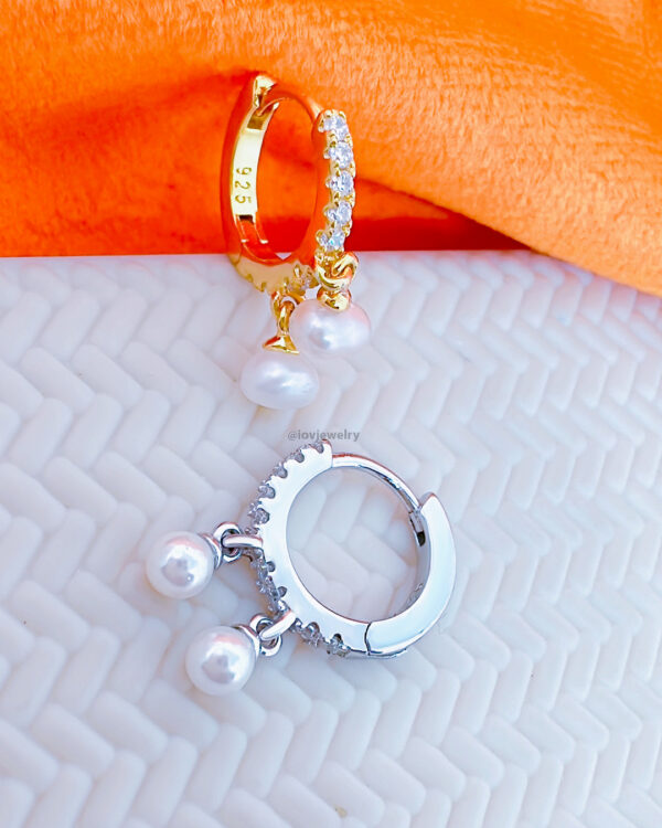 CZ huggie hoop earring with dangling two pearls.