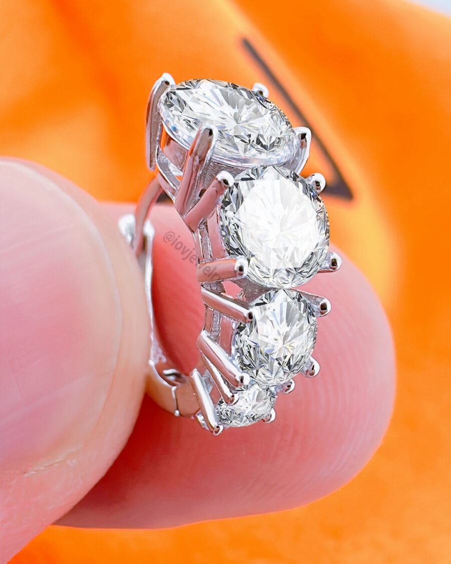 huggie hoop earring with graduated round CZ stones.