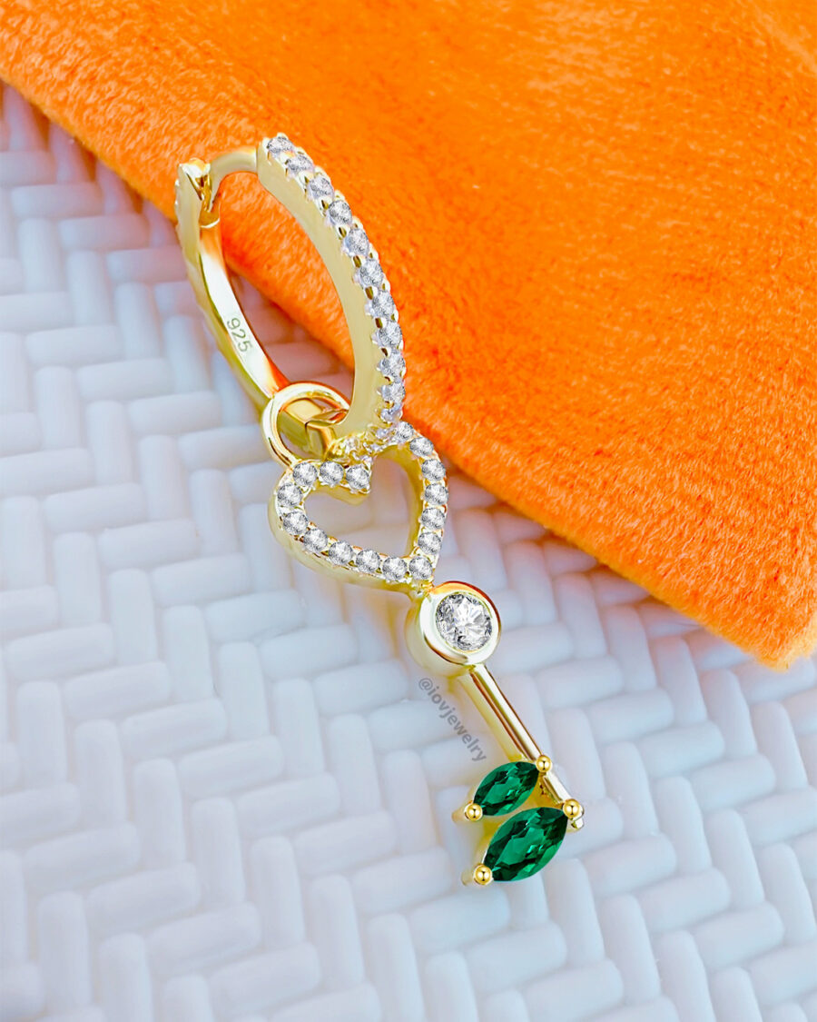 heart key shape dangling huggie hoop earring.