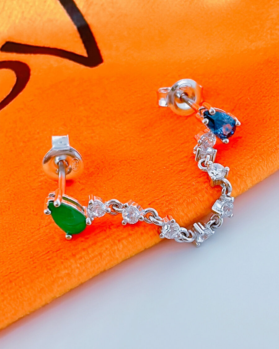 green and blue double stud earring linked with white CZ in prong setting.