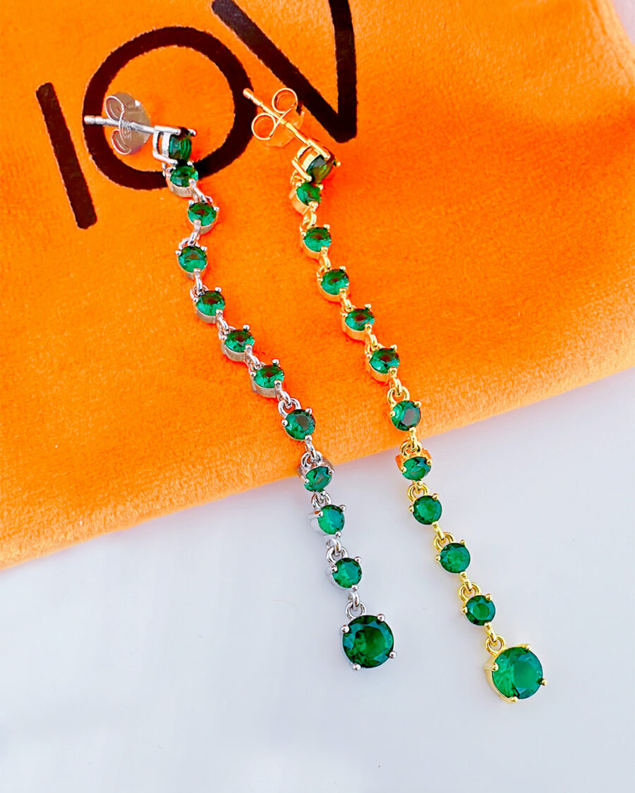 long line of emerald color round stones stud earring.