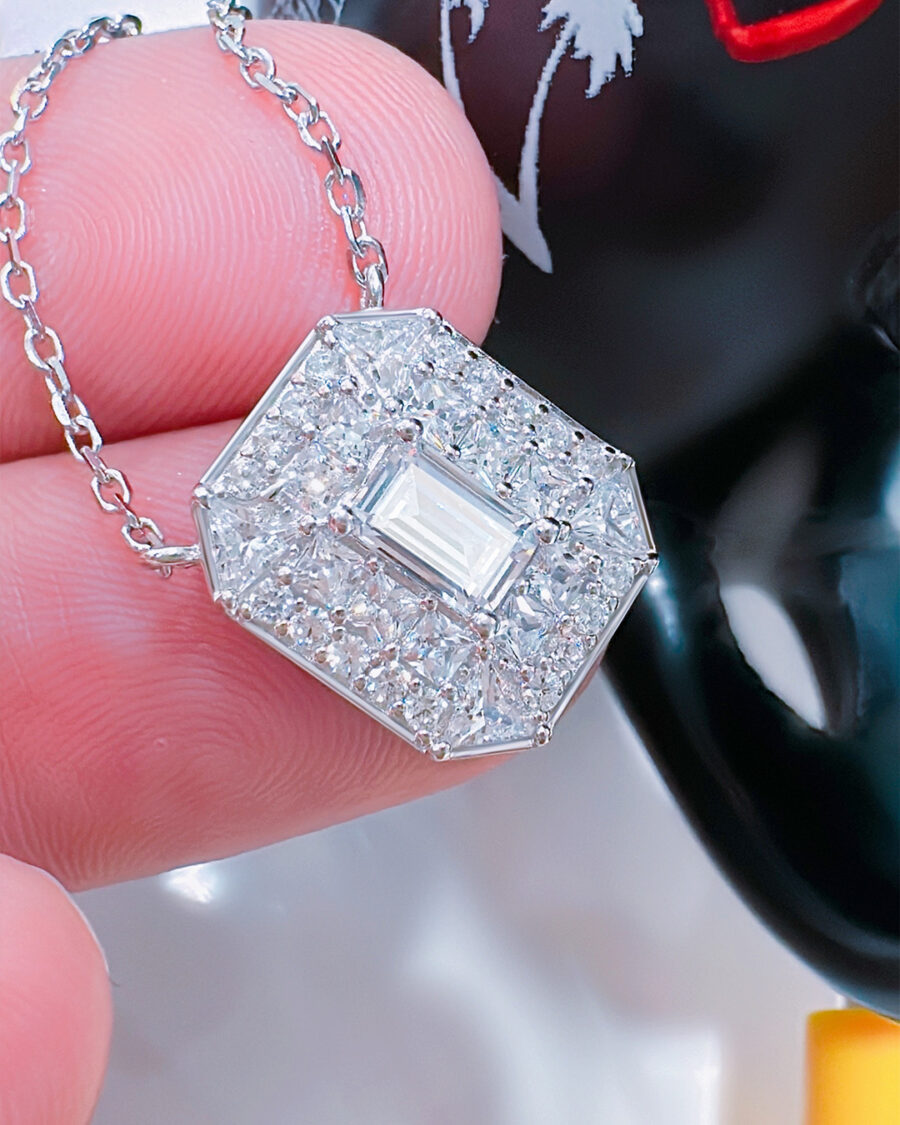 rectangular shape necklace with emerald cut CZ stone in center.