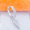 CZ huggie hoop with dangling triangle shape.