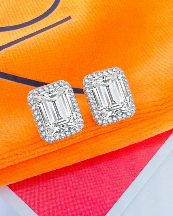 emerald cut CZ stone in a halo setting stud earrings.