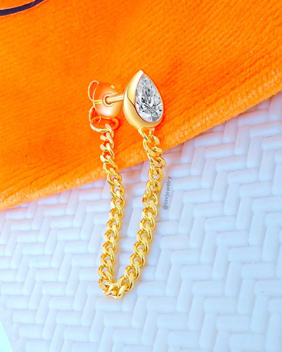 CZ pear shape in a bezel setting with back and front curb chain.