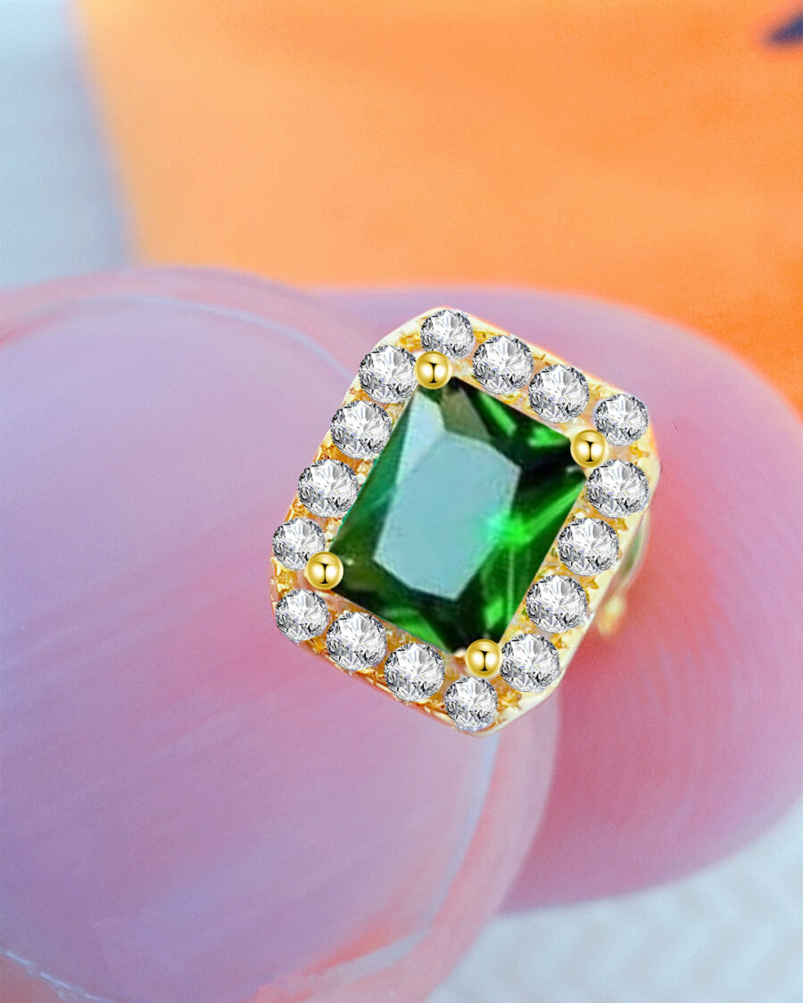 CZ emerald color rectangular stone in a halo setting stud earring. - Image 3