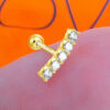 one size round CZ stones in a curved line ballback piercing earring.