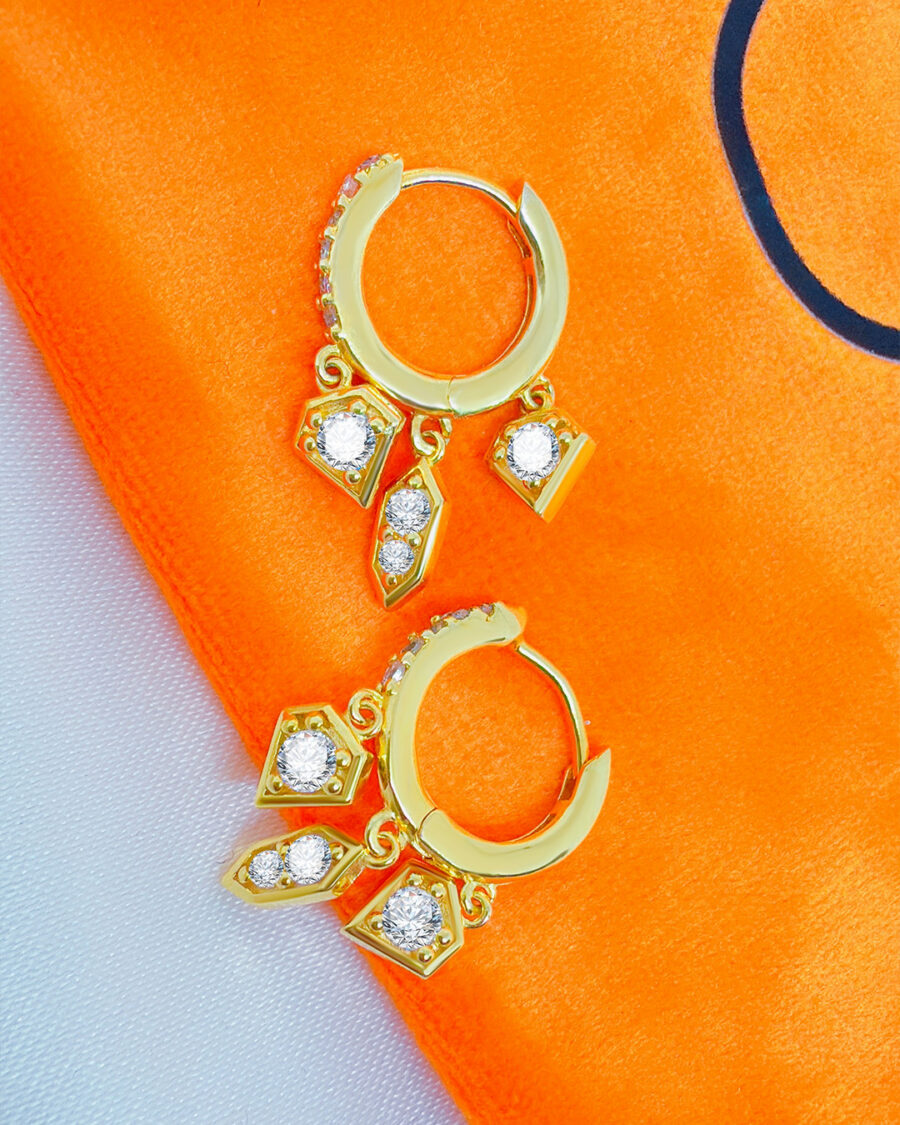 CZ hoop earring with three dangling shapes.