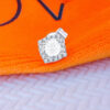 CZ round stone in a square halo setting stud earring.