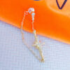 back to front chain earring with dangling star.