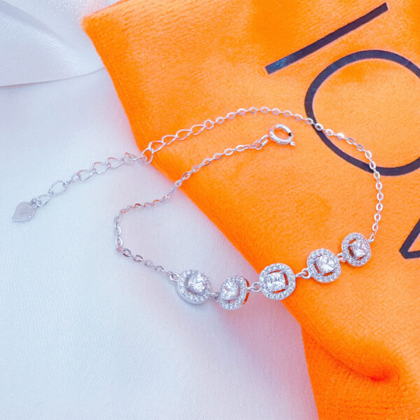 CZ cushion shapes in a halo setting bracelet.